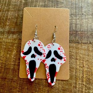 Bloody ghost face earrings.